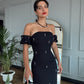 Schwarzes Off-Shoulder-Maxikleid – Elegante Silhouette mit Perlenverzierungen