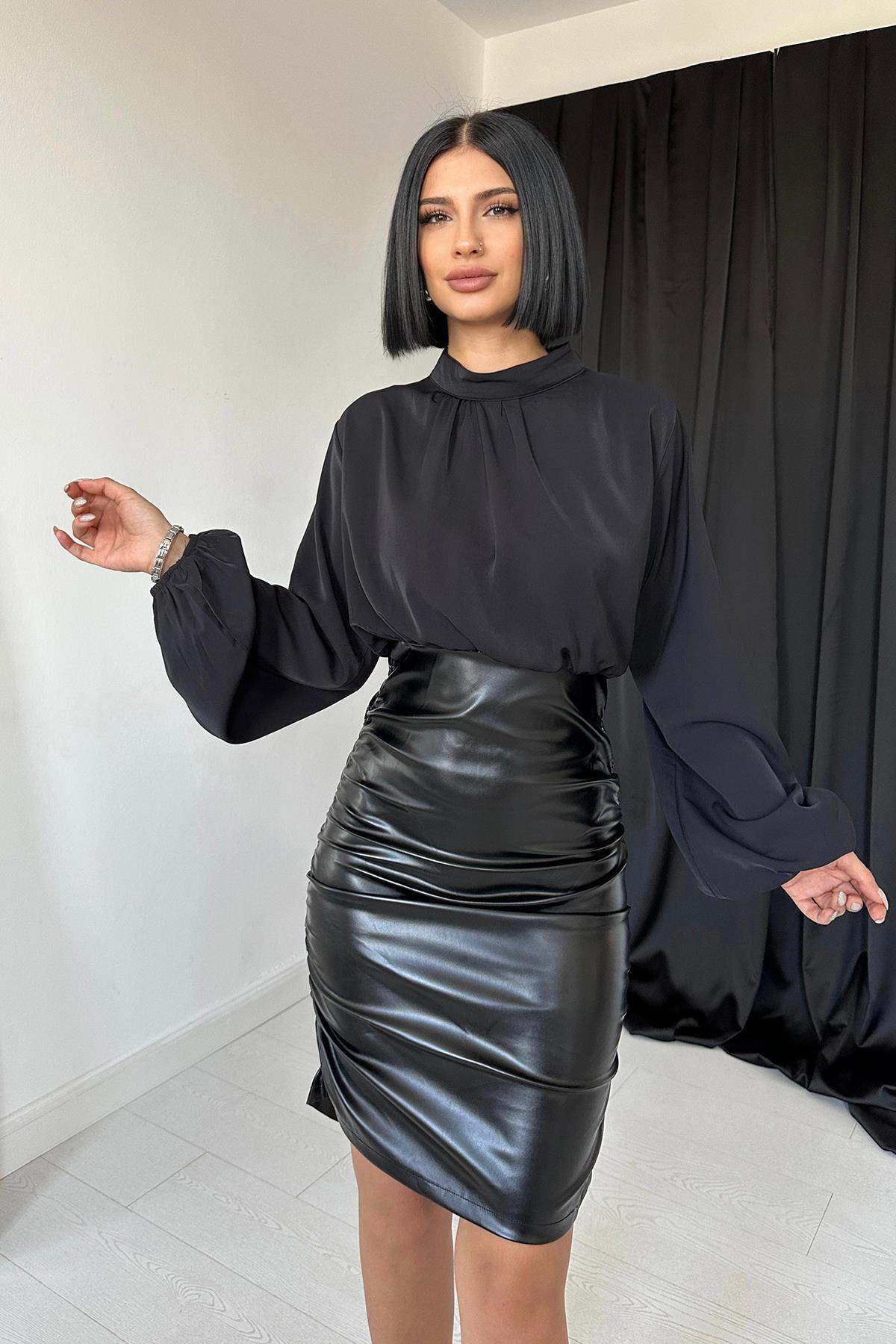 Schwarzes Kleid aus Kunstleder und Satin – Eleganter Power-Look in einem Stück